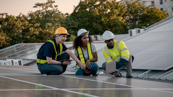 service engineer checking solar cell on the roof for maintenance if there is a damaged part. engineer worker install solar panel. clean energy concept.